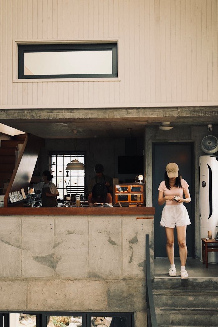 about-us Relaxed atmosphere in a charming Jeju Island cafe with a young woman enjoying her visit.